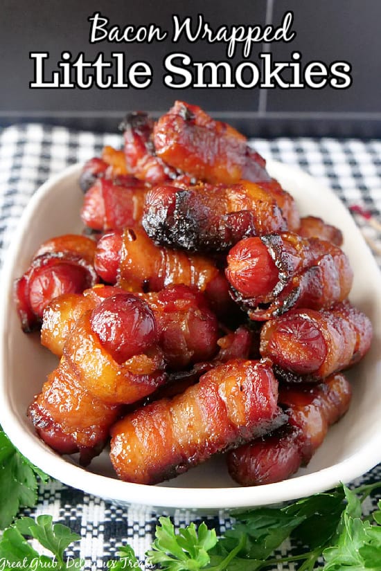 Easy Bacon Wrapped Little Smokies are in a white shallow bowl stacked on top of each other with the title overlay at the top.