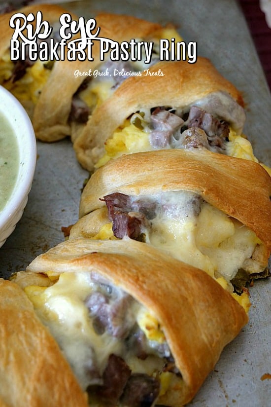 Rib Eye Breakfast Pastry Ring is loaded with leftover rib eye, scrambled eggs, cheese, onions all wrapped in crescents. #ribeyerecipes #beefrecipes #breakfast #brunch #greatgrubdelicioustreats