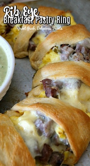 Rib Eye Breakfast Pastry Ring is made with rib eye, eggs, cheese, seasoned deliciously and stuffed in a pastry ring then baked. #deliciousrecipes #easyrecipe #ribeyebreakfast #crescentrecipes #greatgrubdelicioustreats
