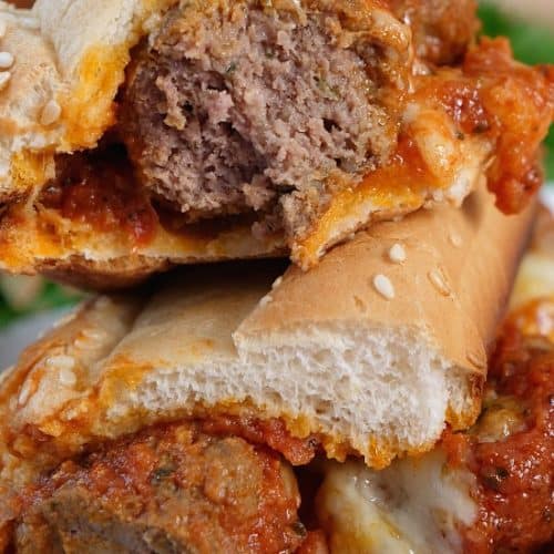 Two meaball sub halves on a plate.