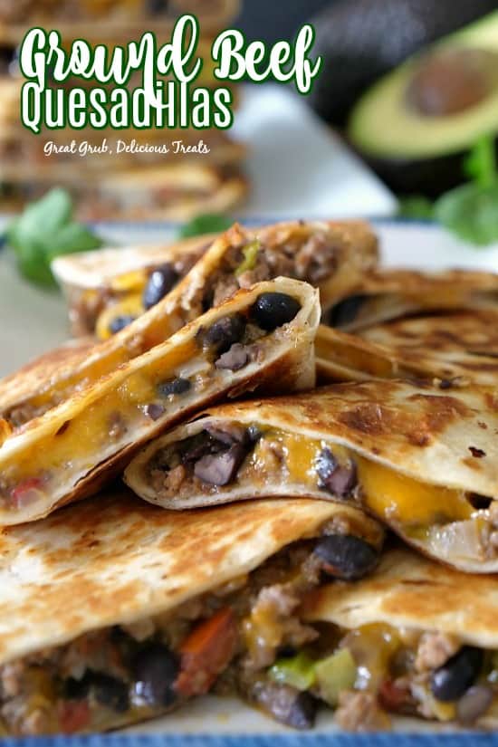 A ground beef quesadilla cut into wedges and piled on top of each other.