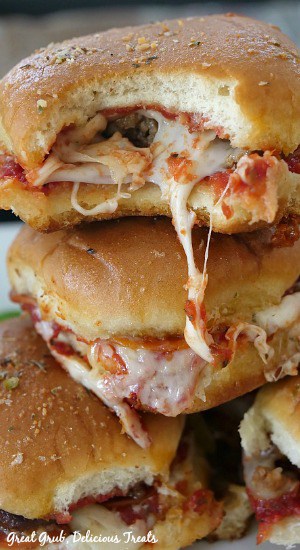 Pepperoni Sausage Pizza Sliders are a scrumptious pizza slider recipe full of pepperoni, sausage and cheese then baked to perfection. #pizzasliders #appetizerrecipe #pepperonipizza #italiansausage #greatgrubdelicioustreats