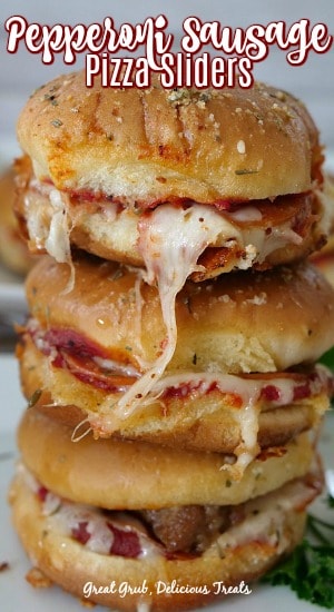 Pepperoni Sausage Pizza Sliders are an easy appetizer recipe loaded with pepperoni, sausage and cheese then baked.