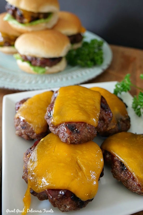 Grilled BBQ Meatloaf Sliders are small little meatloaf burgers grilled, topped with barbecue sauce and cheese. #grilledburgers #easyrecipes #dinnerideas #burgers #greatgrubdelicioustreats Grilled BBQ Meatloaf Sliders are small little meatloaf burgers grilled, topped with barbecue sauce and cheese.