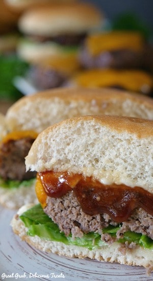 Grilled BBQ Meatloaf Sliders are individual hand-held meatloaf sliders with melted cheese and bbq sauce. #grilled #burgerideas #food #recipes #greatgrubdelicioustreats Grilled BBQ Meatloaf Sliders are individual hand-held meatloaf sliders with melted cheese and bbq sauce.