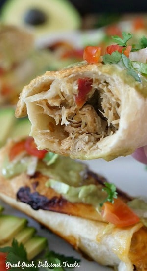 Spicy Chicken Flautas are an easy weeknight dinner idea, loaded with shredded, slow cooked chicken breast, two types of cheese and then baked until crispy.