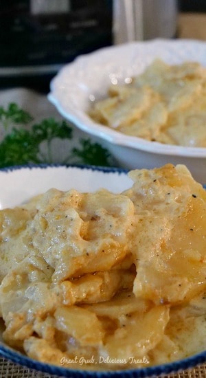 Crock Pot Cheesy Scalloped Potatoes are creamy, loaded with sharp cheddar cheese and are delicious. #crockpotpotatoes #potatorecipes #cheesy #slowcookerideas #greatgrubdelicioustreats Crock Pot Cheesy Scalloped Potatoes
