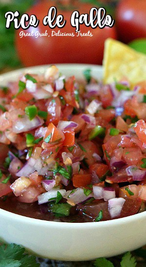 Pico de Gallo is made with fresh ingredients and is loaded with flavor. A chunky salsa recipe that is perfect to serve with tortilla chips or to add to any Mexican recipe. A white bowl filled with Pico de Gallo.