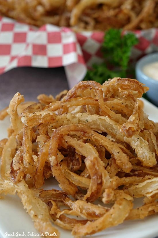 Fried Onion Strings are super easy to make and loaded with delicious flavors.