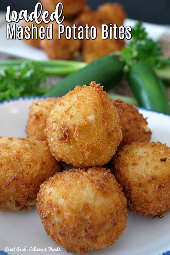 Mashed Potato bites on a white plate with jalape&ntilde;os and cilantro in the background.