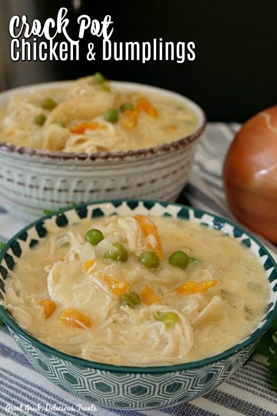 Crock Pot Chicken and Dumplings is a quick and easy slower cooker recipe perfect for a delicious crock pot weeknight meal. Chicken and dumplings in a teal and white spotted bowl with a white and burgundy bowl in the background filled with chicken and dumplings.