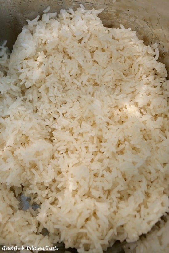 Easy Instant Pot White Rice is a simple rice recipe made in no time in the instant pot. Instant Pot White Rice - a photo of fluffy white rice in the Instant Pot pan.
