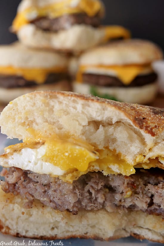 Breakfast Sandwiches are a delicious and filling meal to eat for any meal of the day. A close up photo of a breakfast sandwich with a bite taken out of it.
