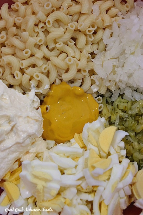 Deviled Egg Macaroni Salad is made with elbow macaroni, eggs, dill relish, onions, mayonnaise and mustard. #macaronipasta #relish #hardboiledeggs #noodles #greatgrubdelicioustreats Deviled Egg Macaroni Salad is made with elbow macaroni, eggs, dill relish, onions, mayonnaise and mustard.