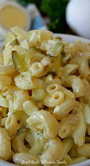 Deviled Egg Macaroni Salad is made with pasta, eggs, pickles, onions, mayonnaise and mustard. #sidedishrecipes #easymacaronisalad #delicioussalads #homemademacaronisalad #greatgrubdelicioustreats Deviled Egg Macaroni Salad is made with pasta, eggs, pickles, onions, mayonnaise and mustard.