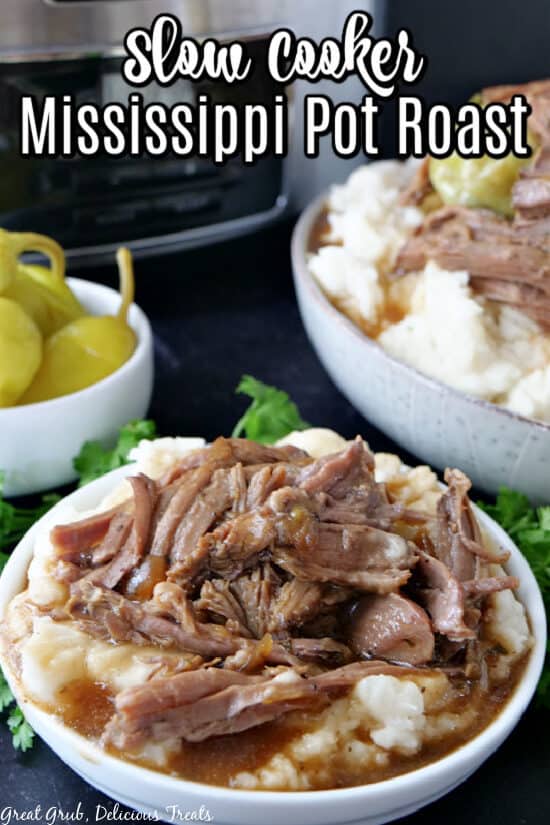 A white bowl with mashed potatoes and pot roast and gravy in it and the title of the recipe at the top of the photo.