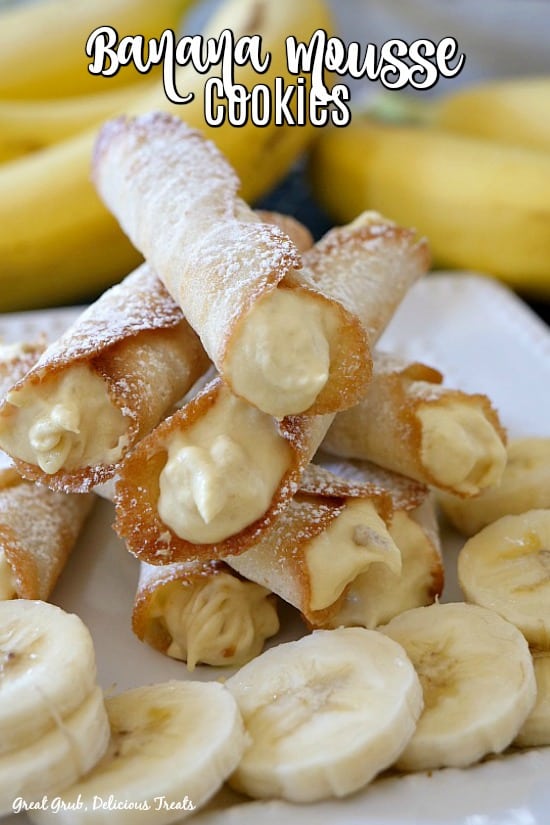 Banana Mousse Cookies are delicious crispy, thin cookies rolled up and filled with a creamy banana mousse. #banana #cookies #cannolis #dessertrecipes #greatgrubdelicioustreats Banana Mousse Cookies are delicious crispy, thin cookies rolled up and filled with a creamy banana mousse.