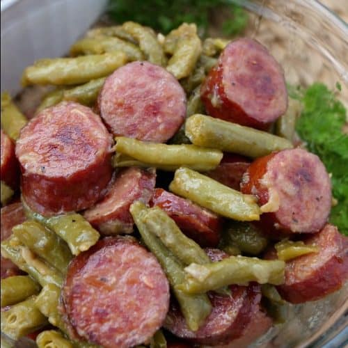 A plateful of kielbasa and green beans.