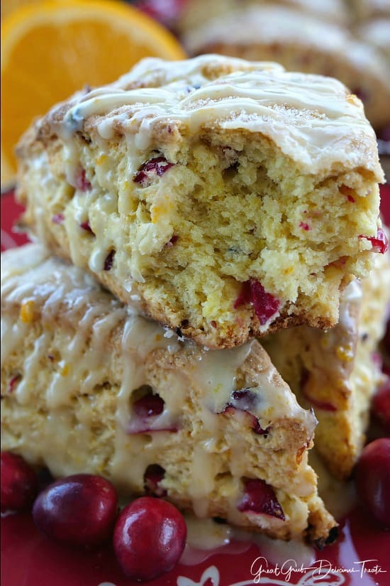 Cranberry Orange Scones are full of delicious cranberry and orange flavor then drizzled with an orange glaze. #yummy #dessertrecipes #bakingrecipes #cranberries #cranberrydesserts Cranberry Orange Scones