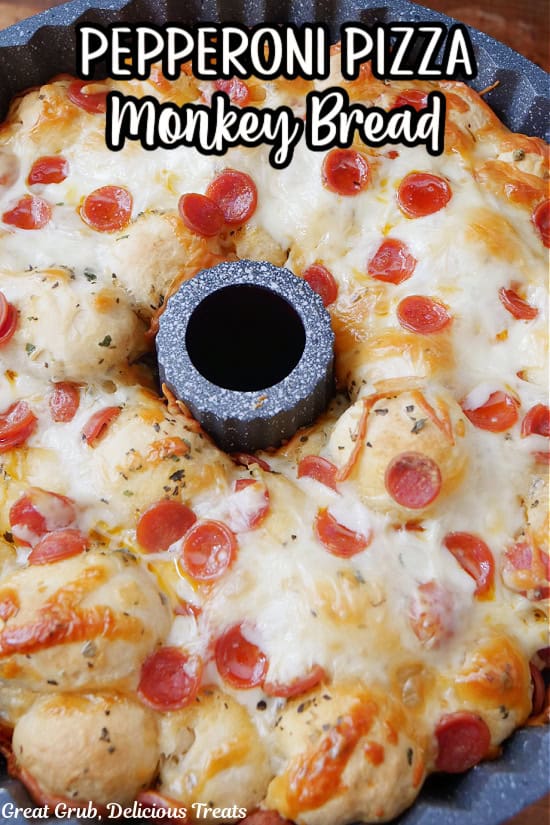 Pepperoni pizza pull apart bread in a bundt pan after being removed from the oven with the title of the recipe at the top in text.