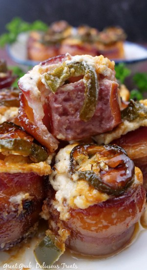 A small stack of pig shots with a bite taken out of one of them.