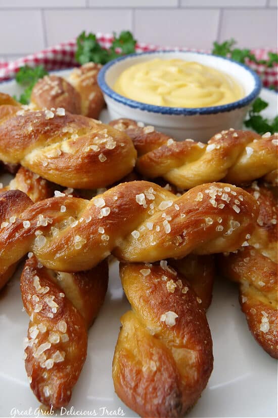A close up photo of soft pretzels with coarse salt on them.