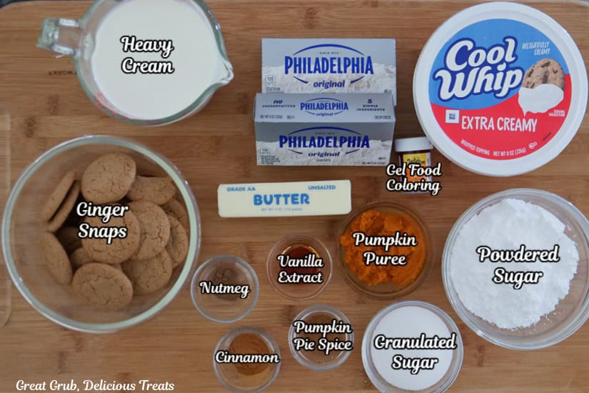 A wood surface with all the ingredients to make pumpkin parfaits place on it.