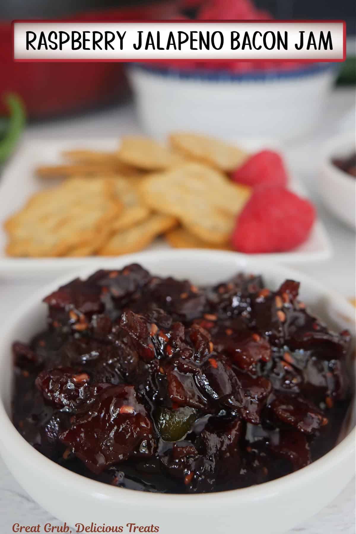 A round white bowl with raspberry jalapeno bacon jam in it with the title overlay at the top.