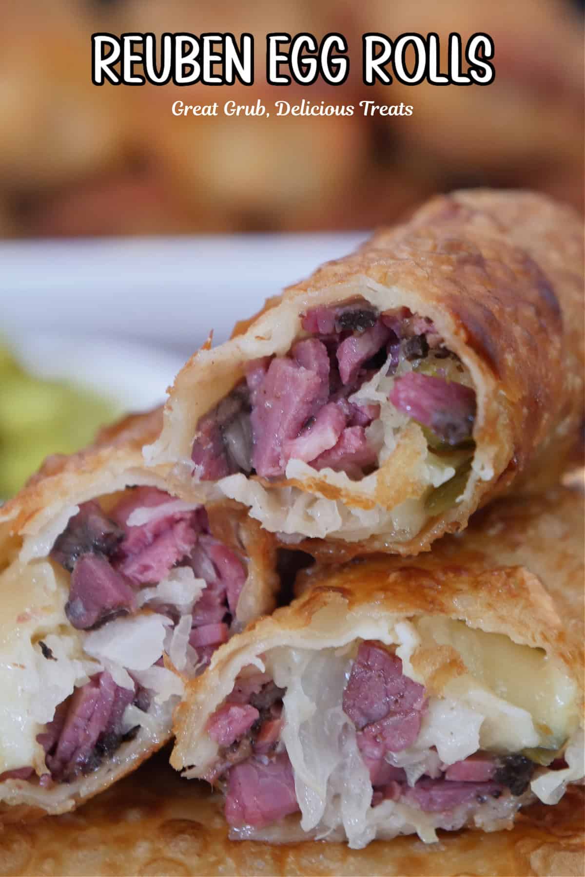 A small stack of Reuben egg rolls stacked on top of each other showing the inside ingredients.