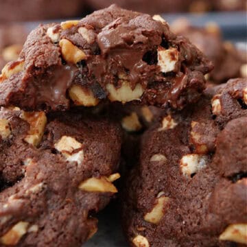 A stack of rocky road dark chocolate cookies with the title in text at the top.