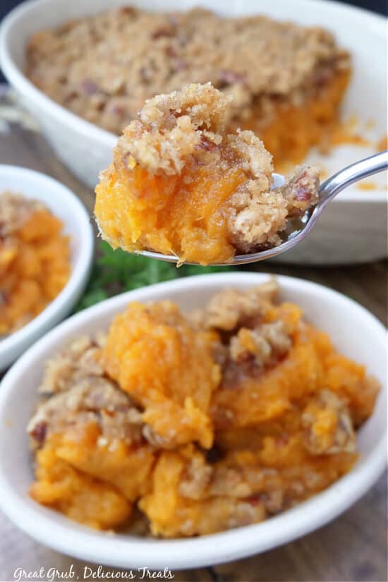 A close up of a spoonful of sweet potato casserole.