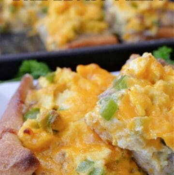 Two slices of breakfast pizza on a white plate.