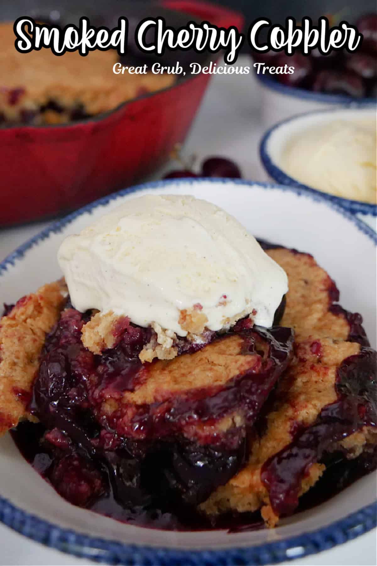 A white blue trimmed bowl with a serving of smoked cherry cobbler in it.