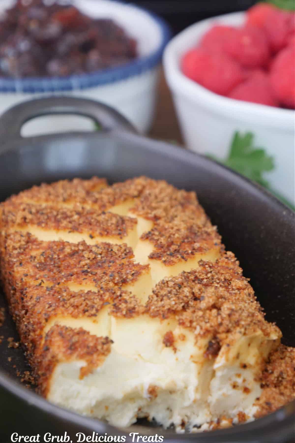 A black oval dish with a smoked cream cheese in it.