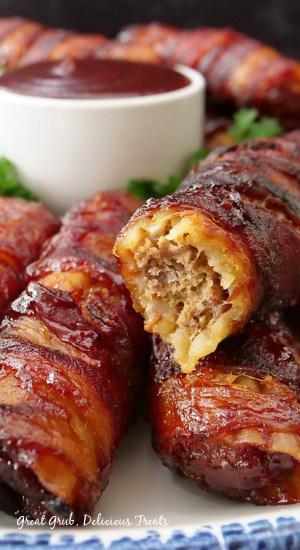 A close up a stuffed manicotti shell with a bite taken out of it.