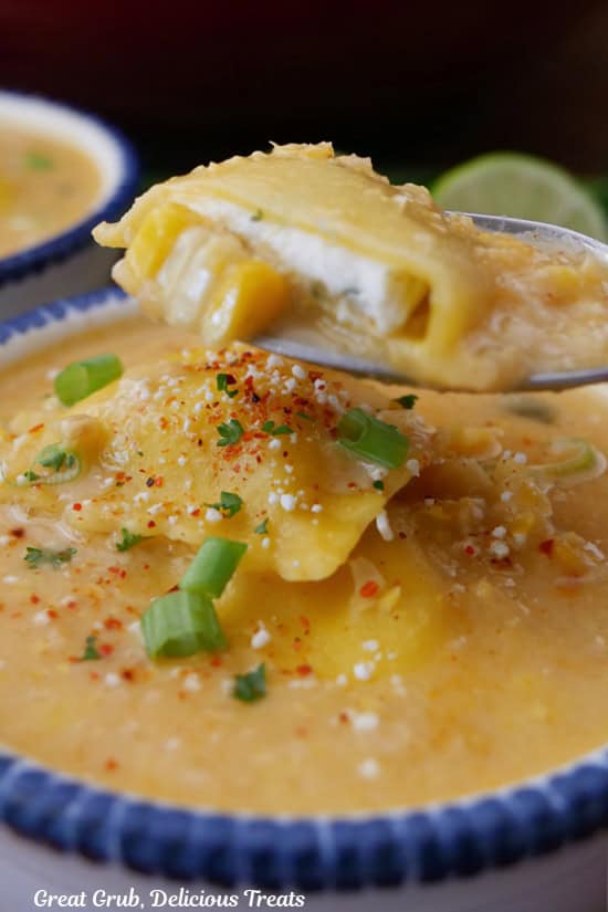 A bite of soup on a spoon.