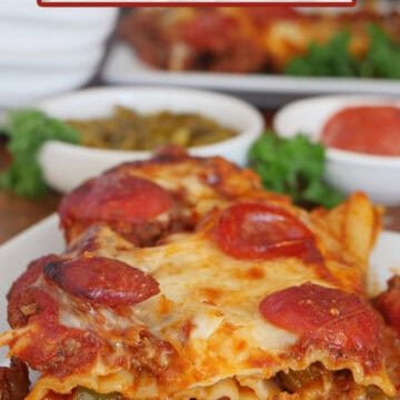 A white plate with a serving of supreme pizza stuffed manicotti on it with the title overlay at the top.