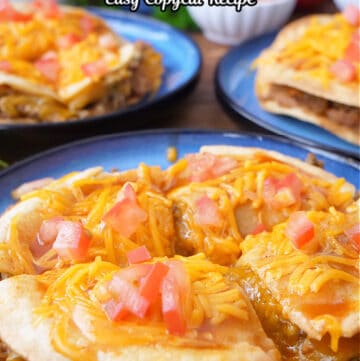 A round blue plate with a homemade taco bell Mexican pizza copycat recipe on it.