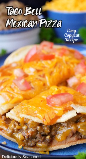 A close up of a Taco Bell Mexican Pizza recipe on a blue plate.