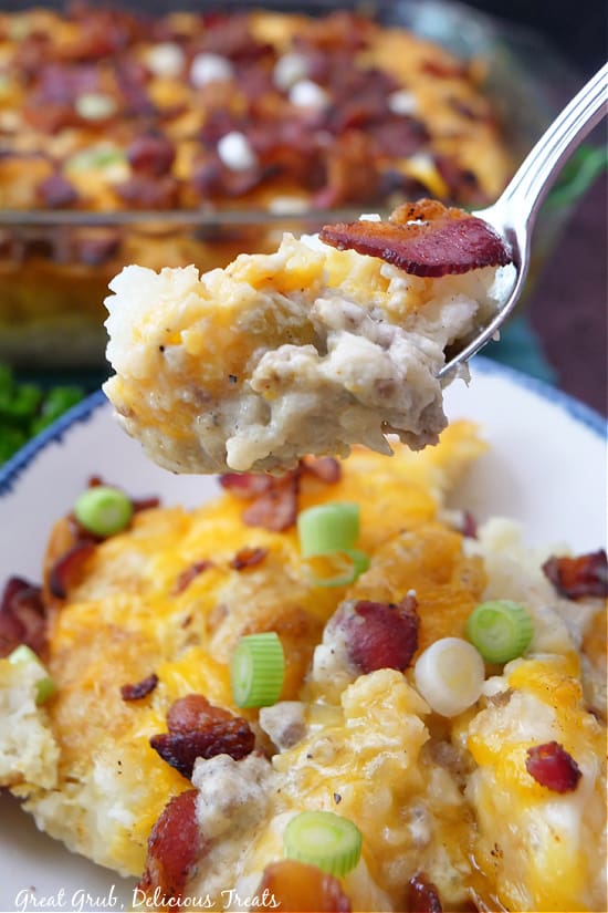 A bite of breakfast casserole on a spoon.