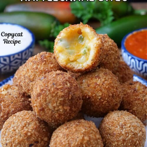 A white plate with blue trim with a stack of about a dozen cheese filled crunchy, copycat Texas Roadhouse Rattlesnake Bites.