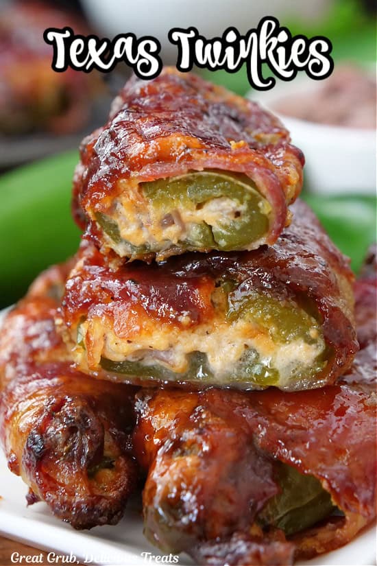 A stack of some Texas Twinkies which are stuffed jalapenos wrapped in bacon and baked, then covered in BBQ sauce.