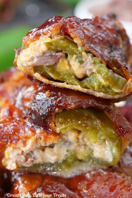 A stack of some Texas Twinkies which are stuffed jalapenos wrapped in bacon and baked, then covered in BBQ sauce.