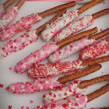 A white surface with Valentine pretzel rods on it and a title overlay at the top.