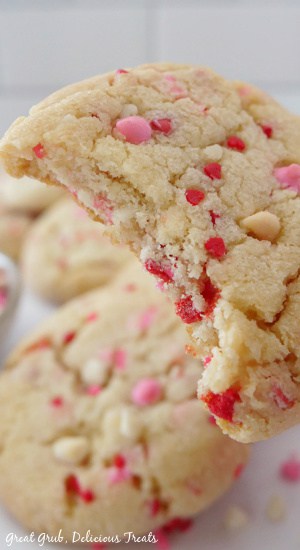 Valentine Sugar Cookies are soft, chewy, and fluffy sugar cookies that are perfect for Valentine’s Day. A close up of a sugar cookie with a bite out of it.