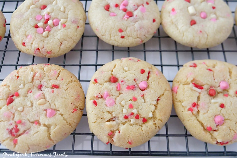 Valentine Sugar Cookies are the perfect cookies to bring to any Valentine’s Day potluck or gathering. A close-up picture of sugar cookies on a wire rack.