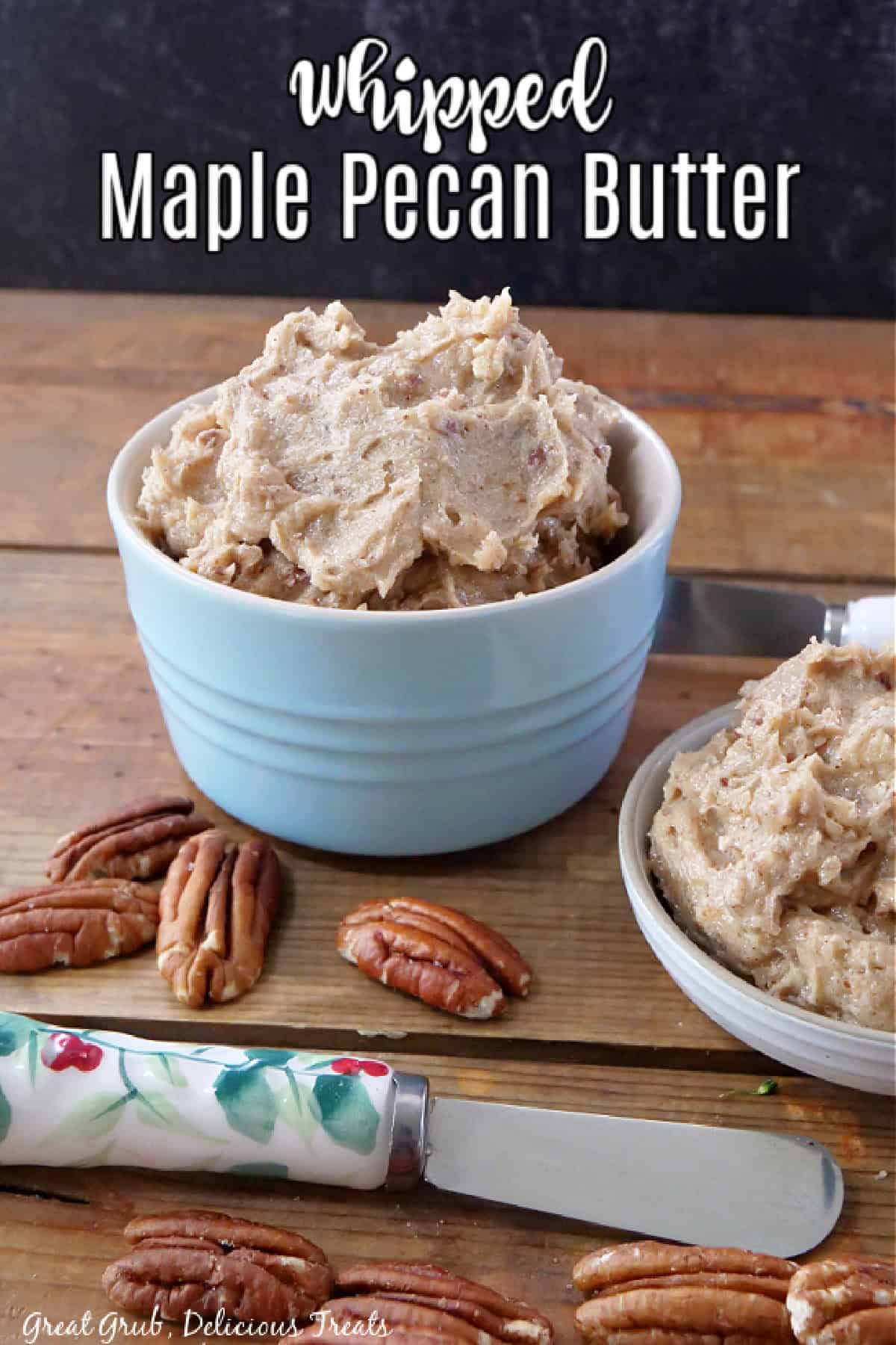 A wood surface with two bowls filled with maple pecan butter.
