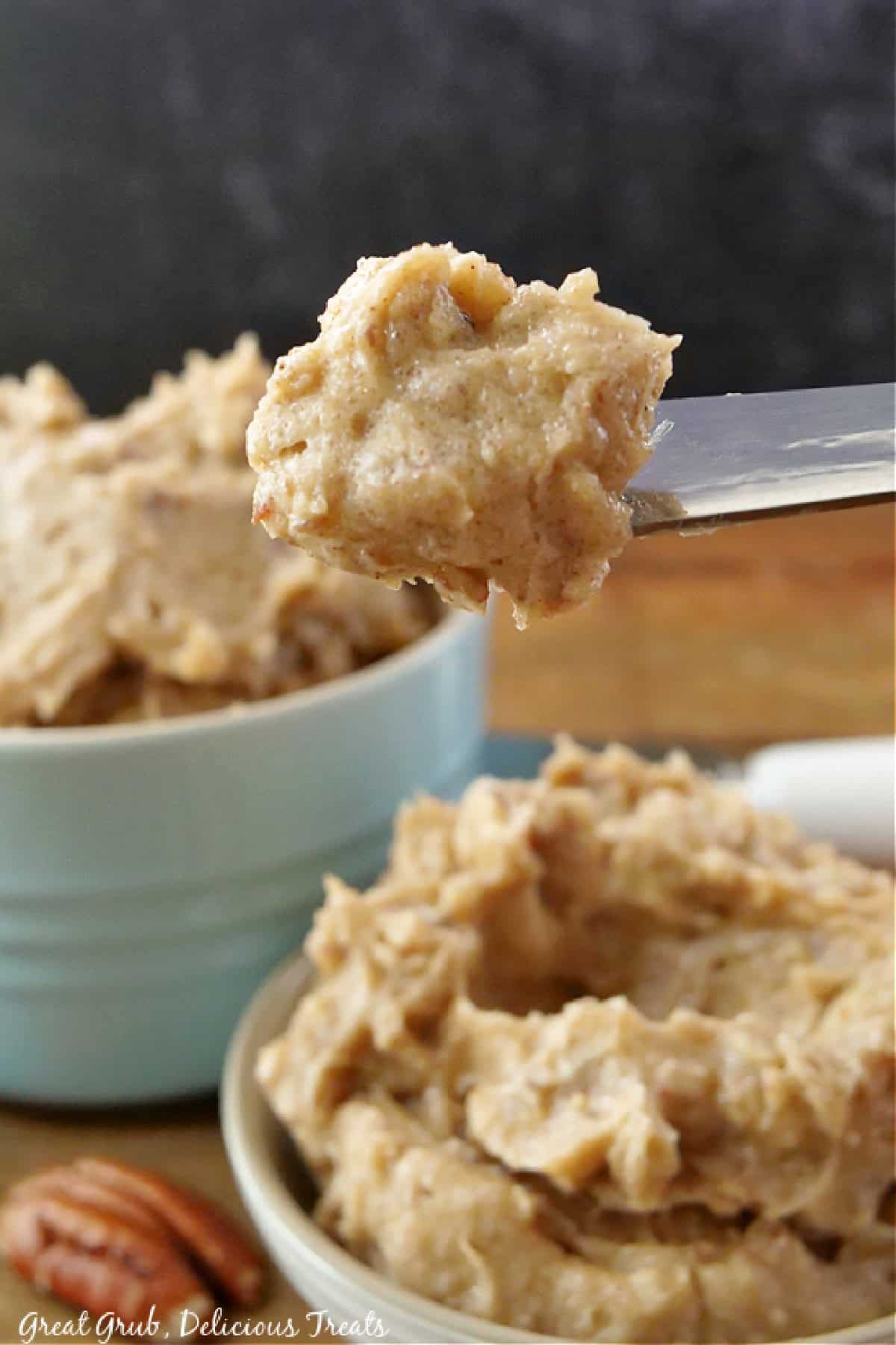 Whipped maple pecan butter on a knife.